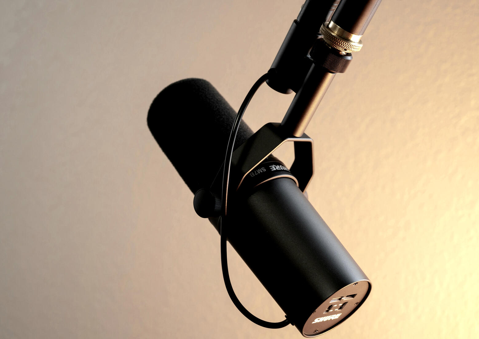 The 1 Eye P.I. Podcast by West Coast Private Investigators A professional Shure SM7B studio microphone on a boom arm, representing The 1 Eye P.I. Podcast hosted by Joe and Imelda of West Coast Private Investigators in Rancho Santa Margarita, CA.
